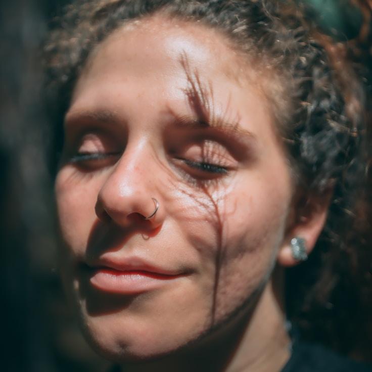 Kaveri Mehta, Lead Design Curator at Trivo Lencia Media, reviewing corporate floral arrangements